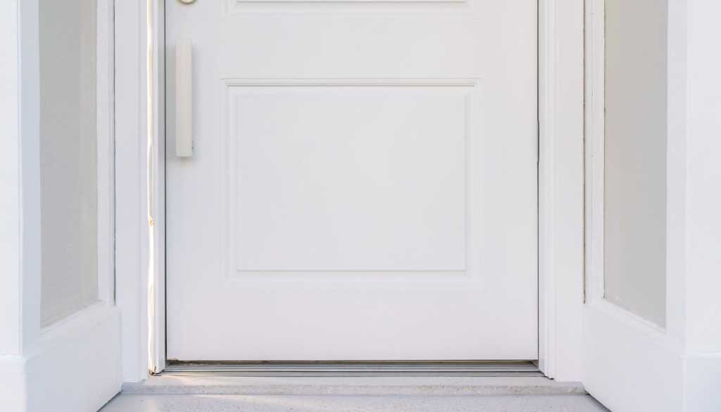 Closed white entry door with an uneven gap and visible daylight along one side of the frame.