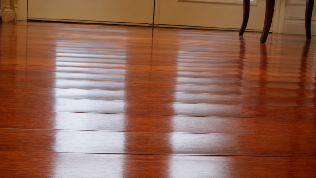 Cupped hardwood flooring with board edges raised slightly higher than the centers.